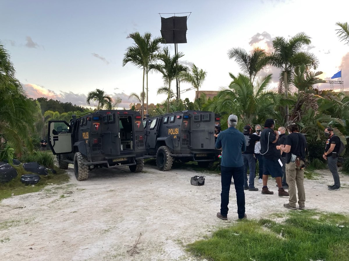 Armored picture vehicles on location at sunset
